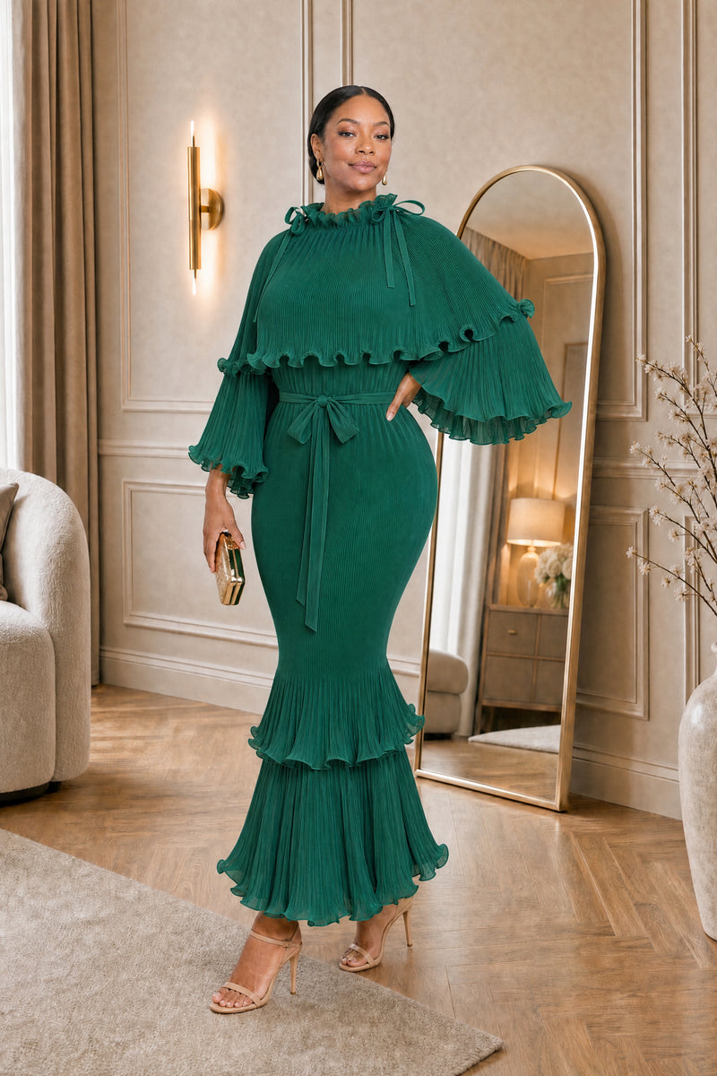 Arabella Plissé Cape Dress in emerald, hand on hip