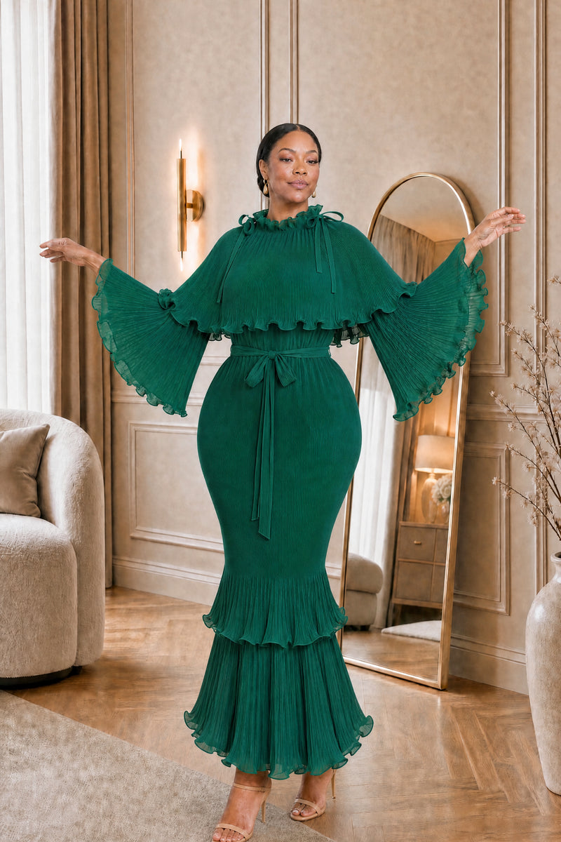 Arabella Plissé Cape Dress in emerald, arms open to show the cape