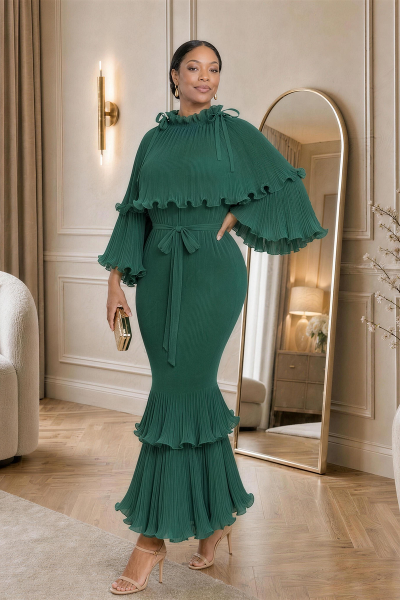 Arabella Plissé Cape Dress in emerald, hand on hip